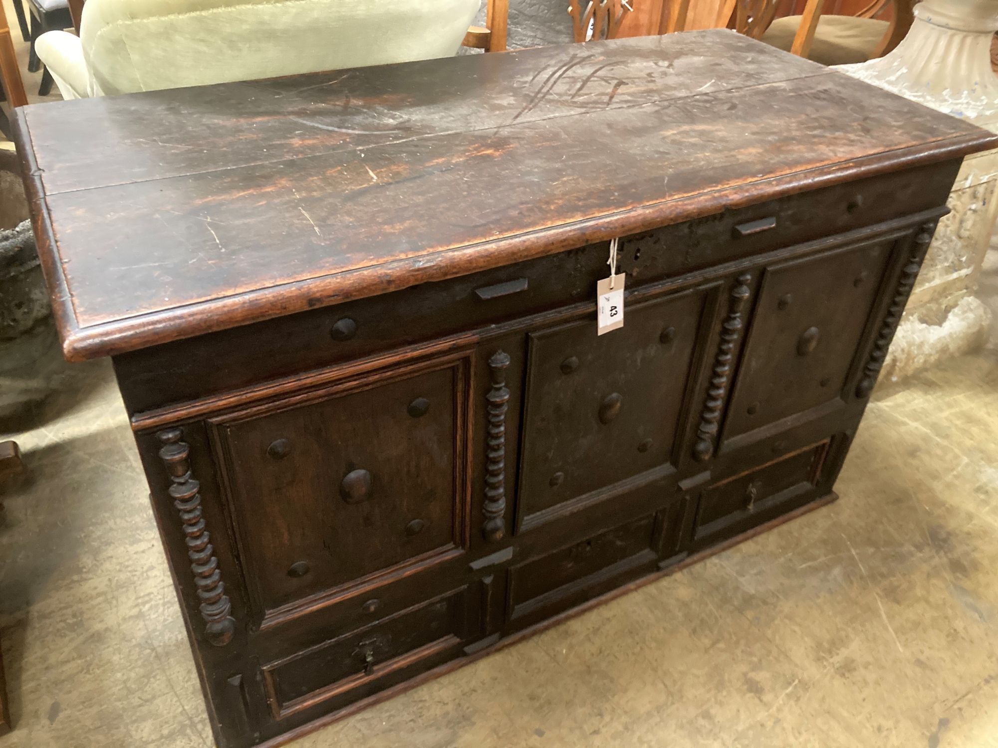 An 18th century panelled oak mule chest, length 117cm, depth 56cm, height 70cm